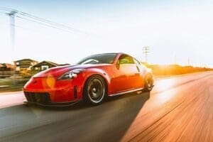 red ferrari 458 italia on road during daytime