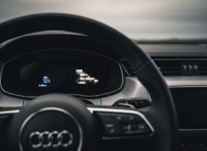 Audi dashboard showing AdBlue warning light with engine restart required message