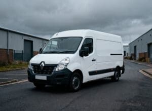 White Renault Master-style van parked on an industrial estate